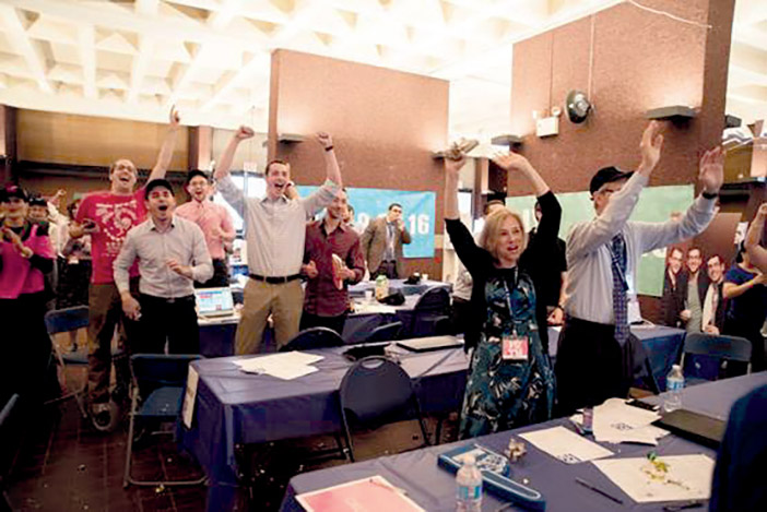 The Yeshiva University call center erupts with excitement when the fundraising goal is reached.